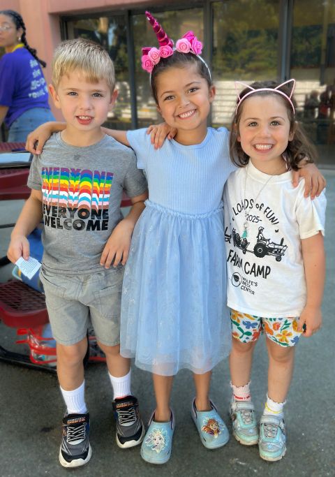 three young children smiling