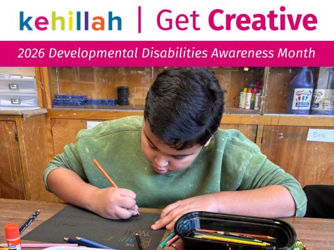 A child drawing with coloring crayons